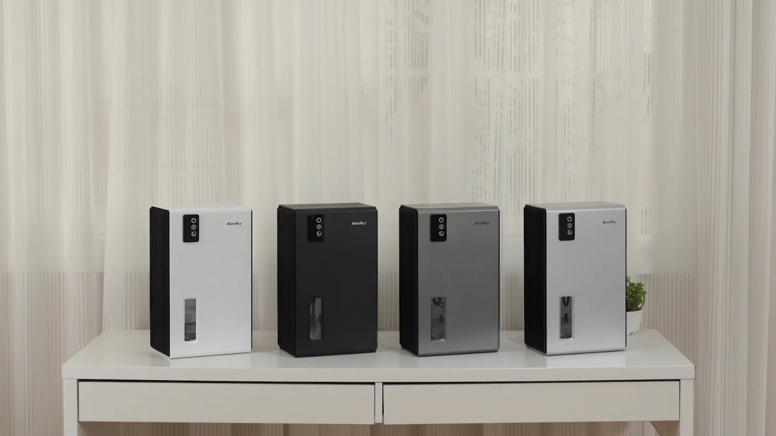 NineSky CT2 dehumidifiers lined up in several finishes